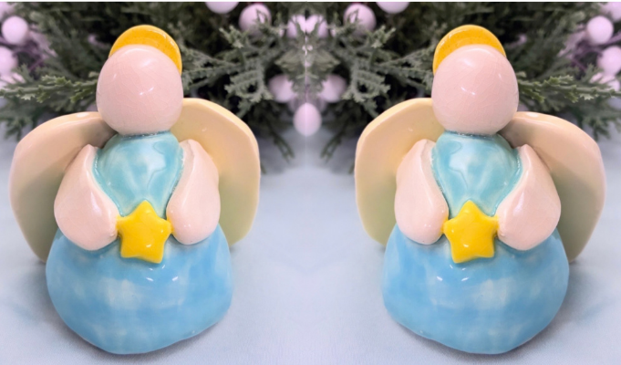 Two handmade pinch pot angels created from clay during a Sunshine Studios art class.