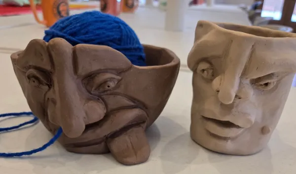 Two funny face vessels created by clay at Sunshine Studios in Maumee Ohio 