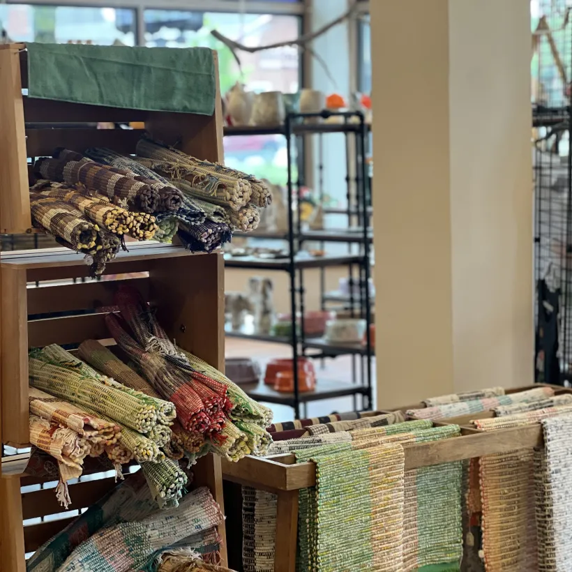 The image shows a cozy craft or artisan shop interior.